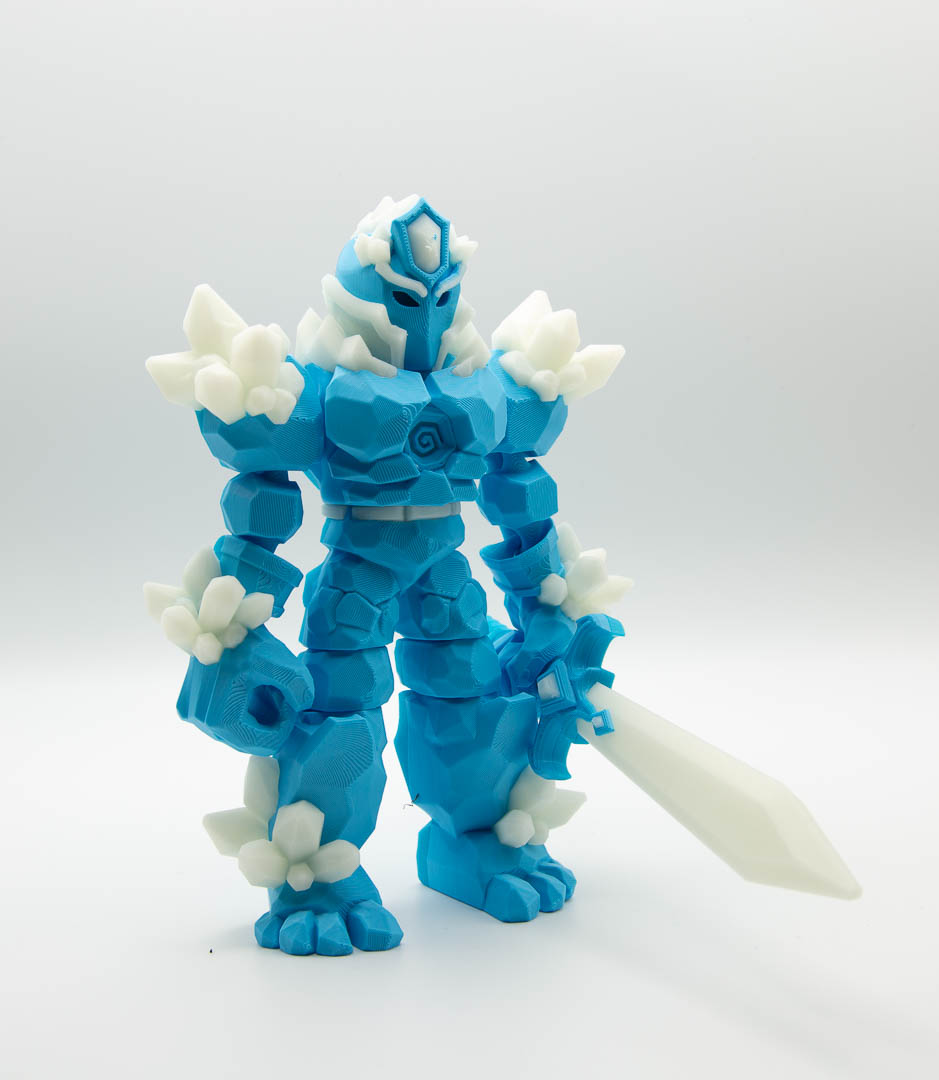 Crystal Warrior articulated 3D printed figure with sword in light blue and glow in the dark