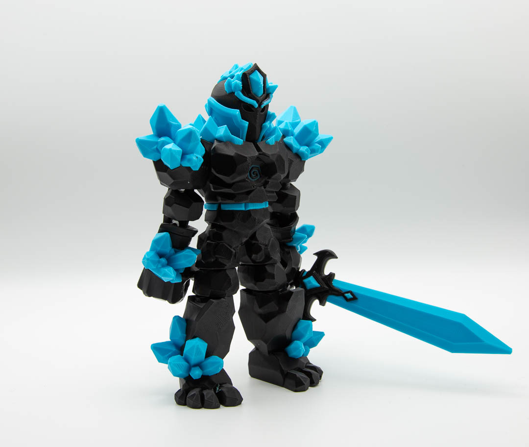 Crystal Warrior articulated 3D printed figure with sword in black and light blue