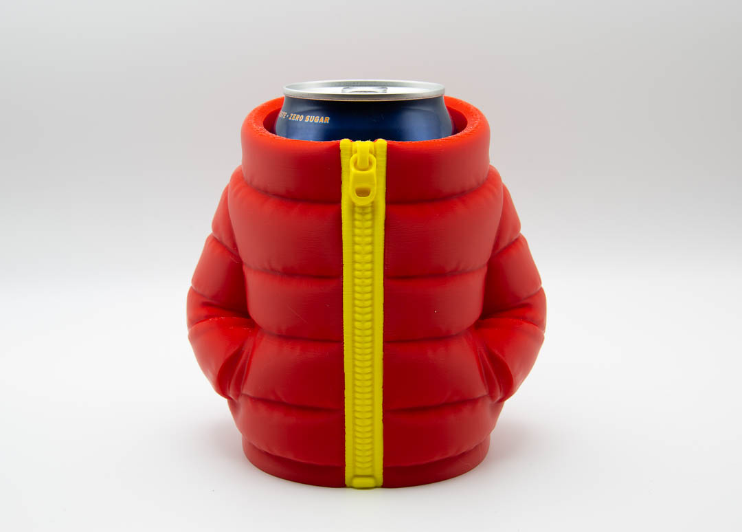 Red 3D printed puffer jacket can holder with yellow zip holding a drinks can