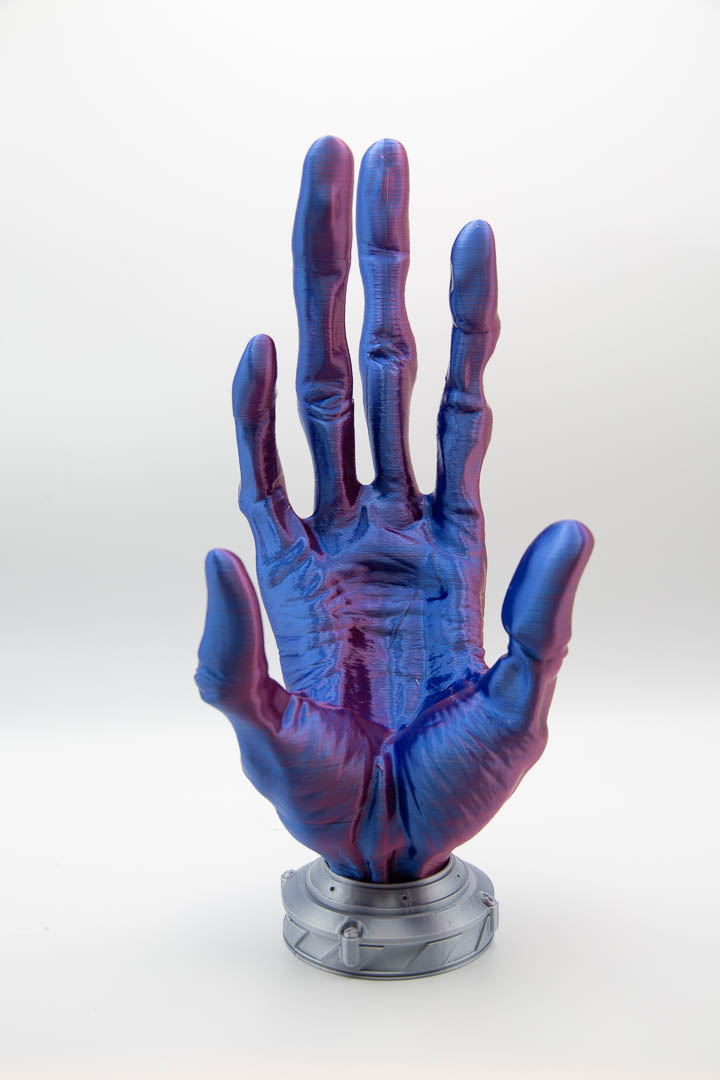 Alien hand controller holder in blue and red silk, front view