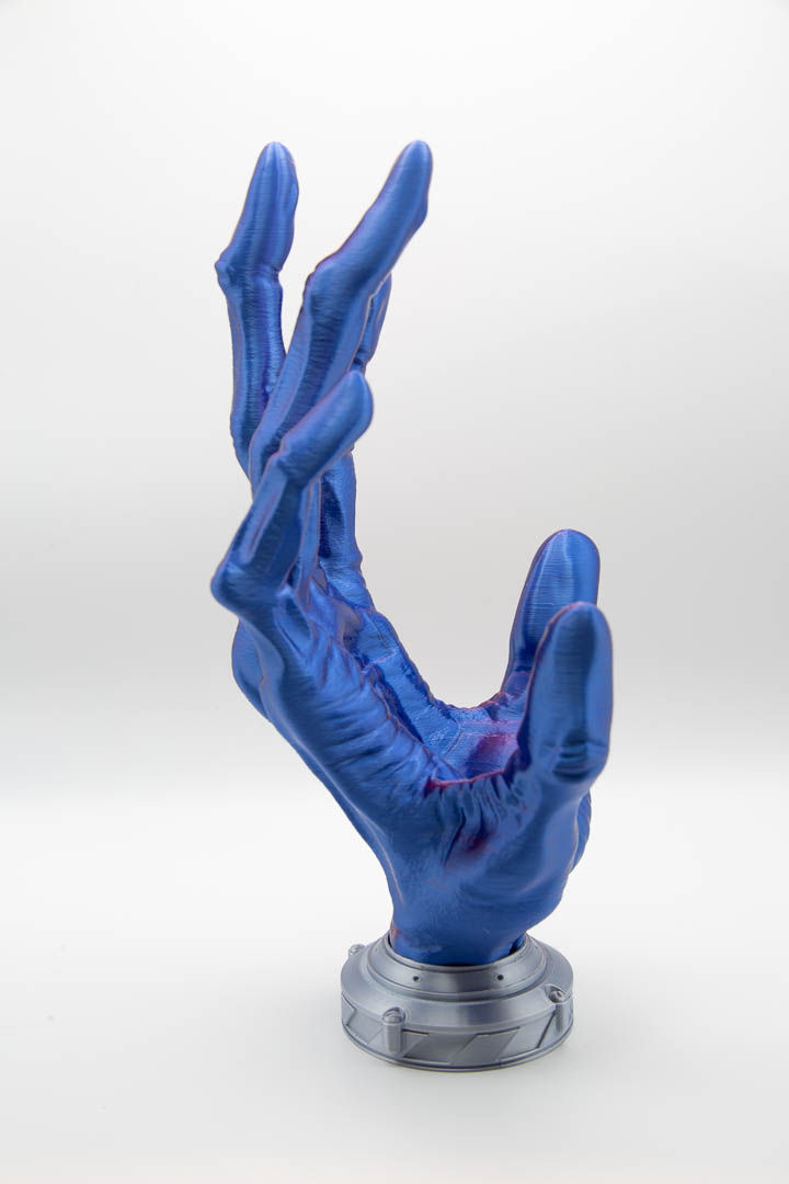 Alien hand controller holder side view showing long fingers