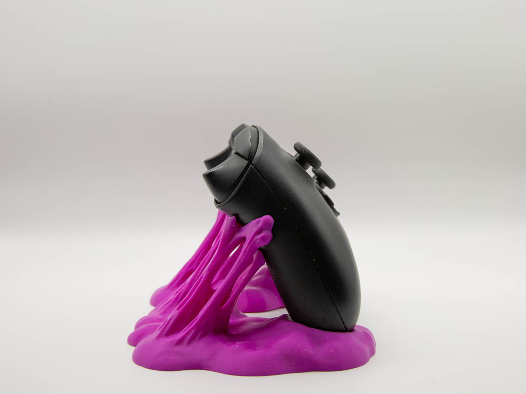 Magenta sticky slime controller holder with an Xbox controller