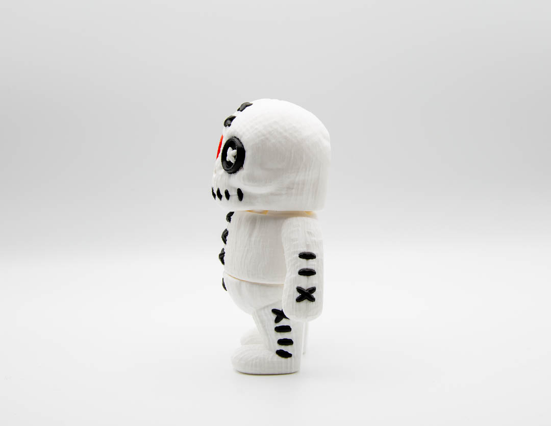 Side view of voodoo doll flexi Mini Big showing stitch details