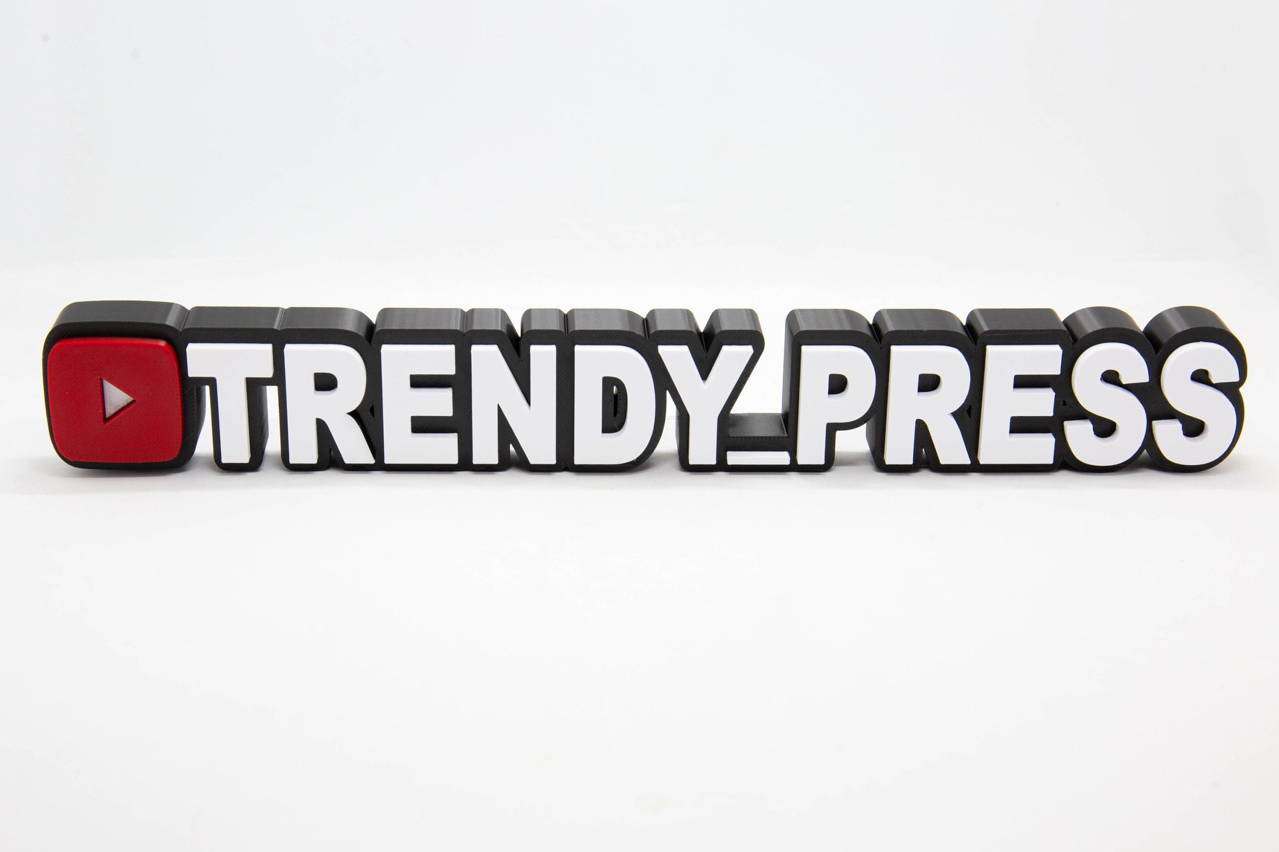 Personalised 3D printed YouTube channel name sign for a creator desk