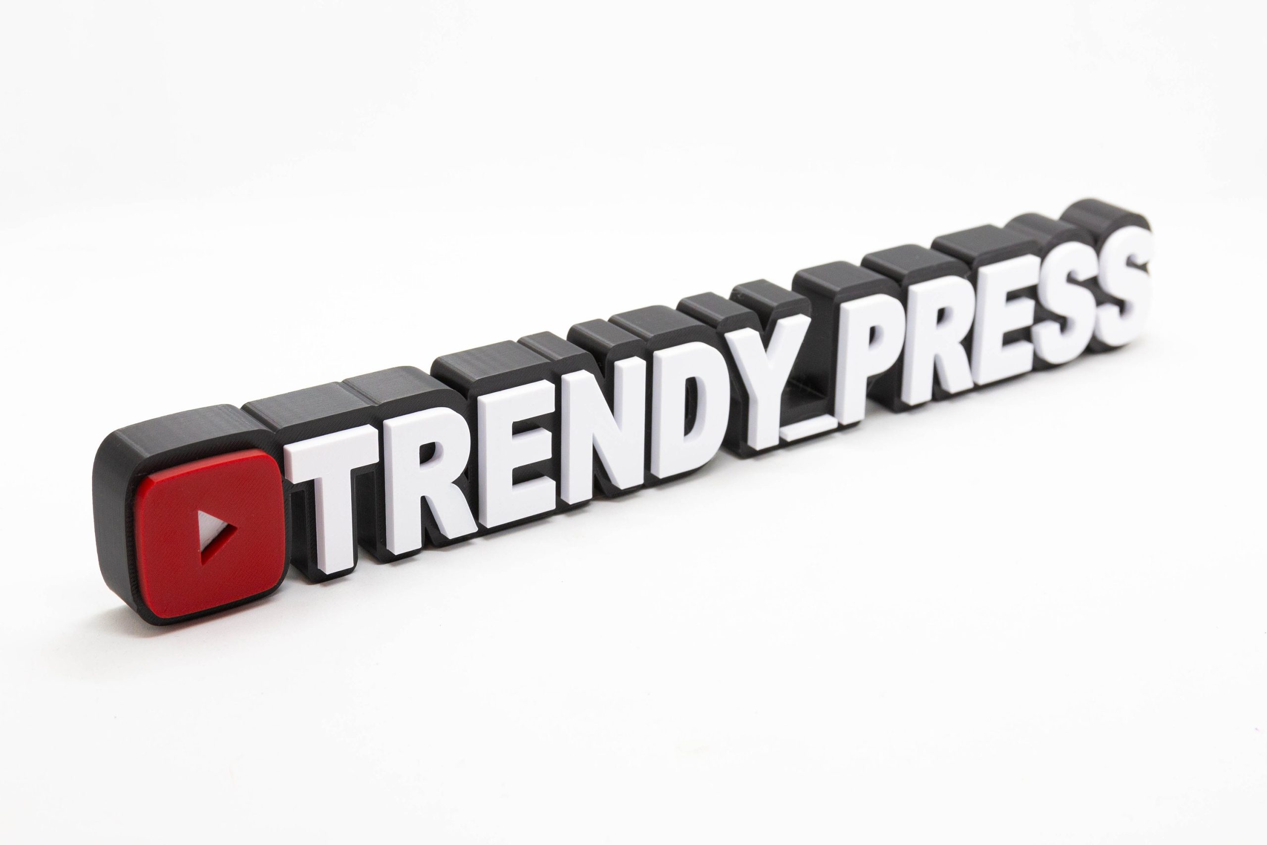 Personalised 3D printed YouTube channel name sign for a creator desk