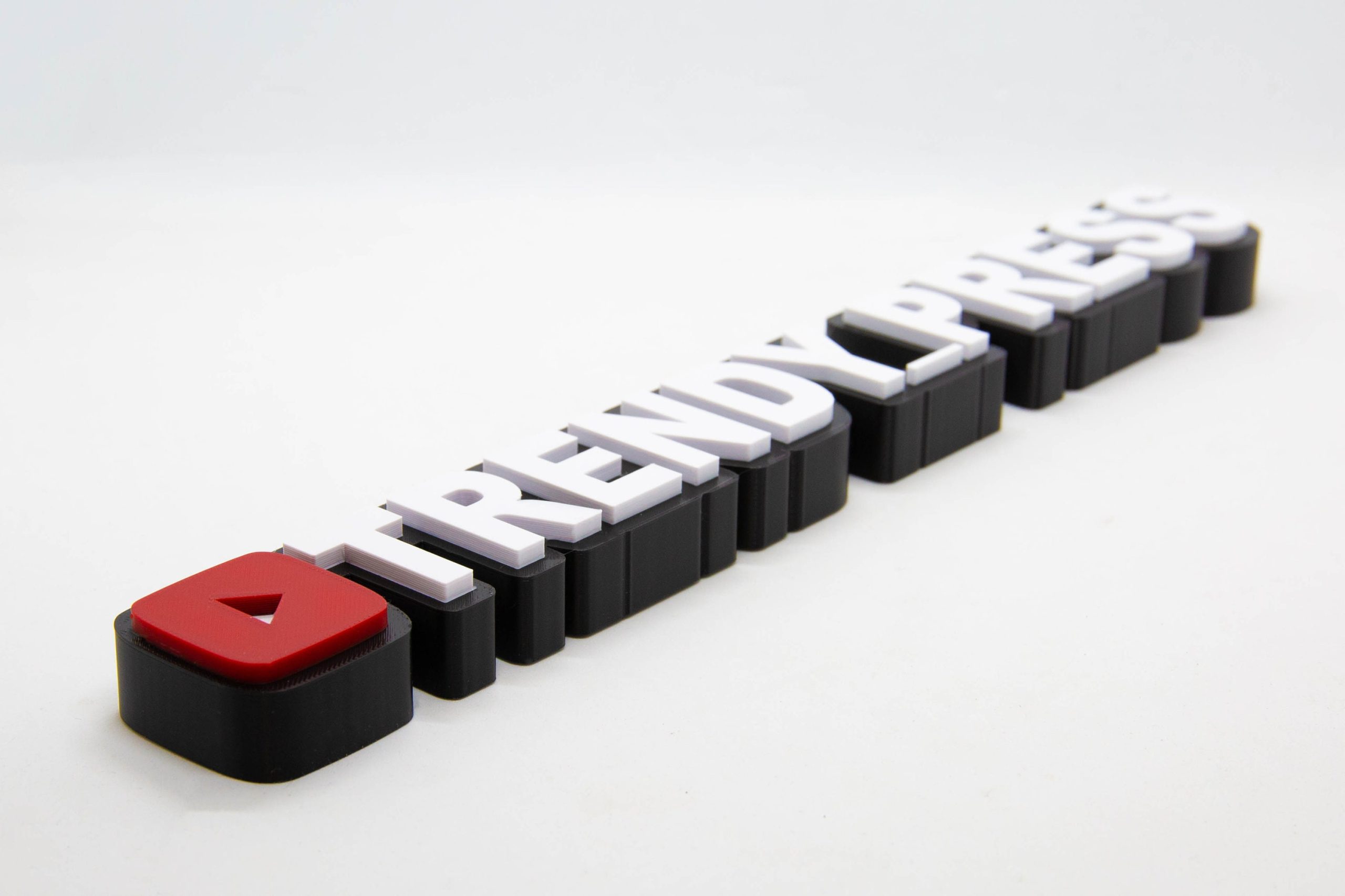 Personalised 3D printed YouTube channel name sign for a creator desk